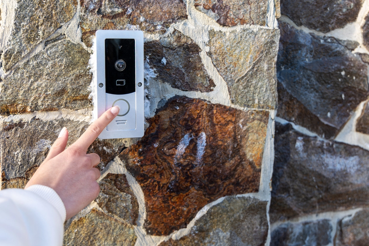 doorbell camera monitoring a building entry point