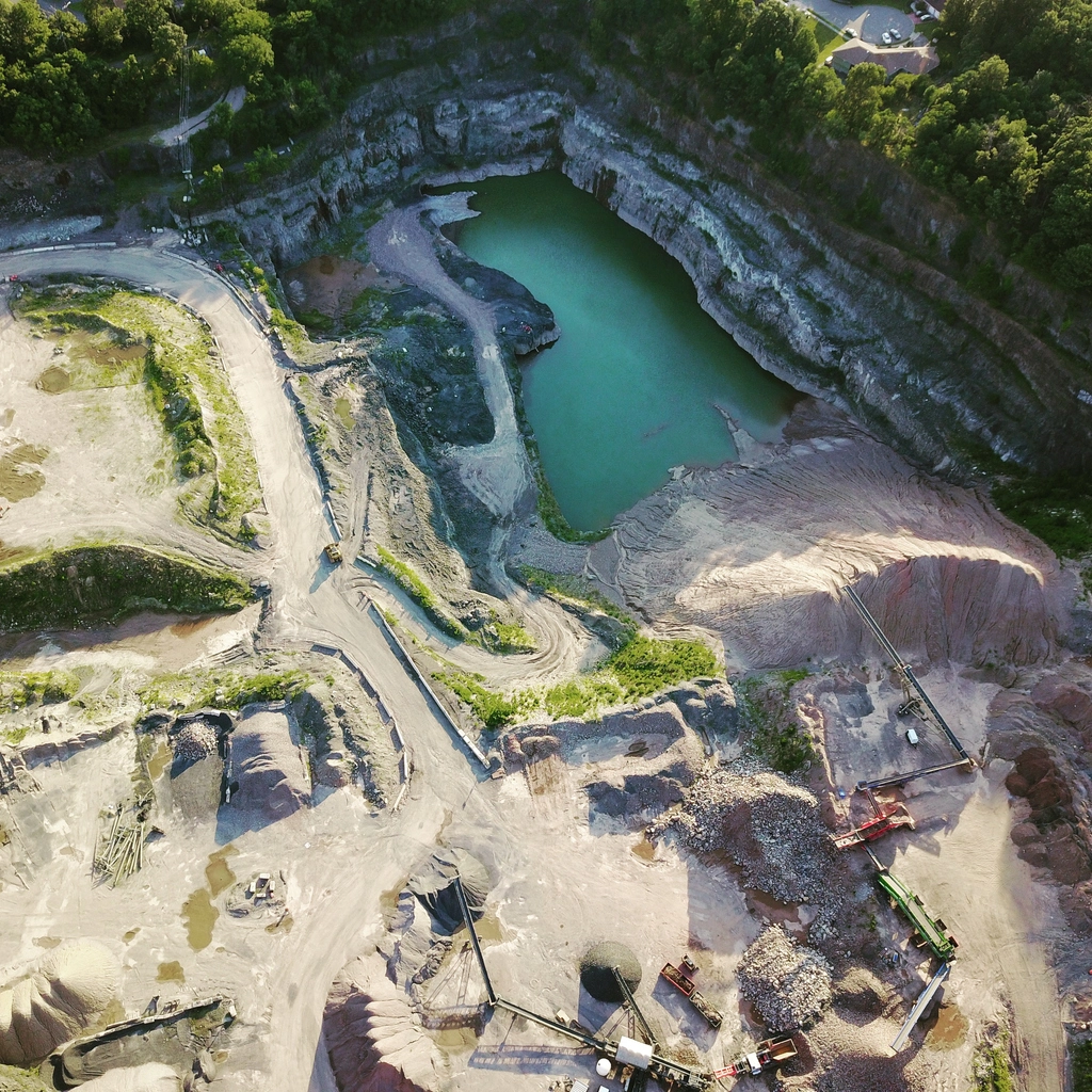 security camera surveillance overlooking active quarry and aggregate work site