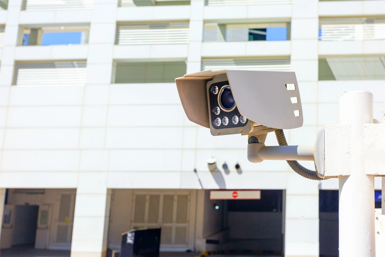 Commercial office entrance monitored for prolonged person activity