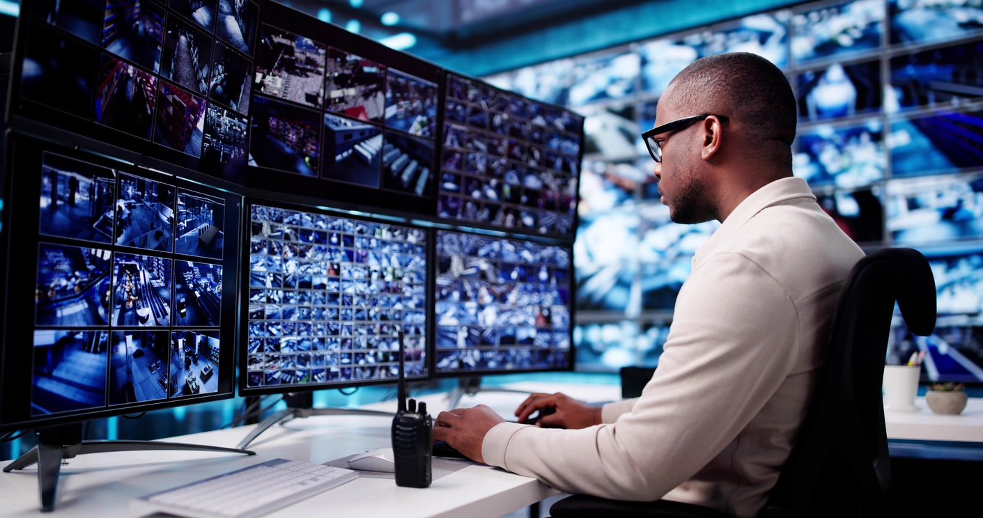 security monitoring operator reviewing integrated video analytics and alarm events