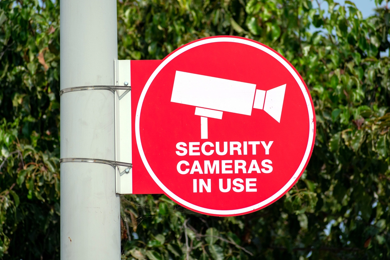 dummy security camera overlooking commercial parking lot deterrence area