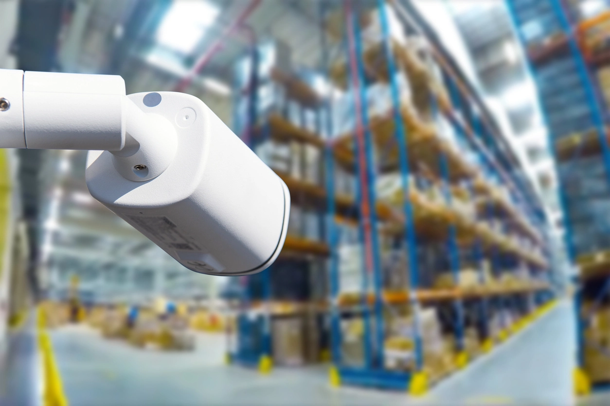 dummy camera installed in warehouse area as visible security deterrent