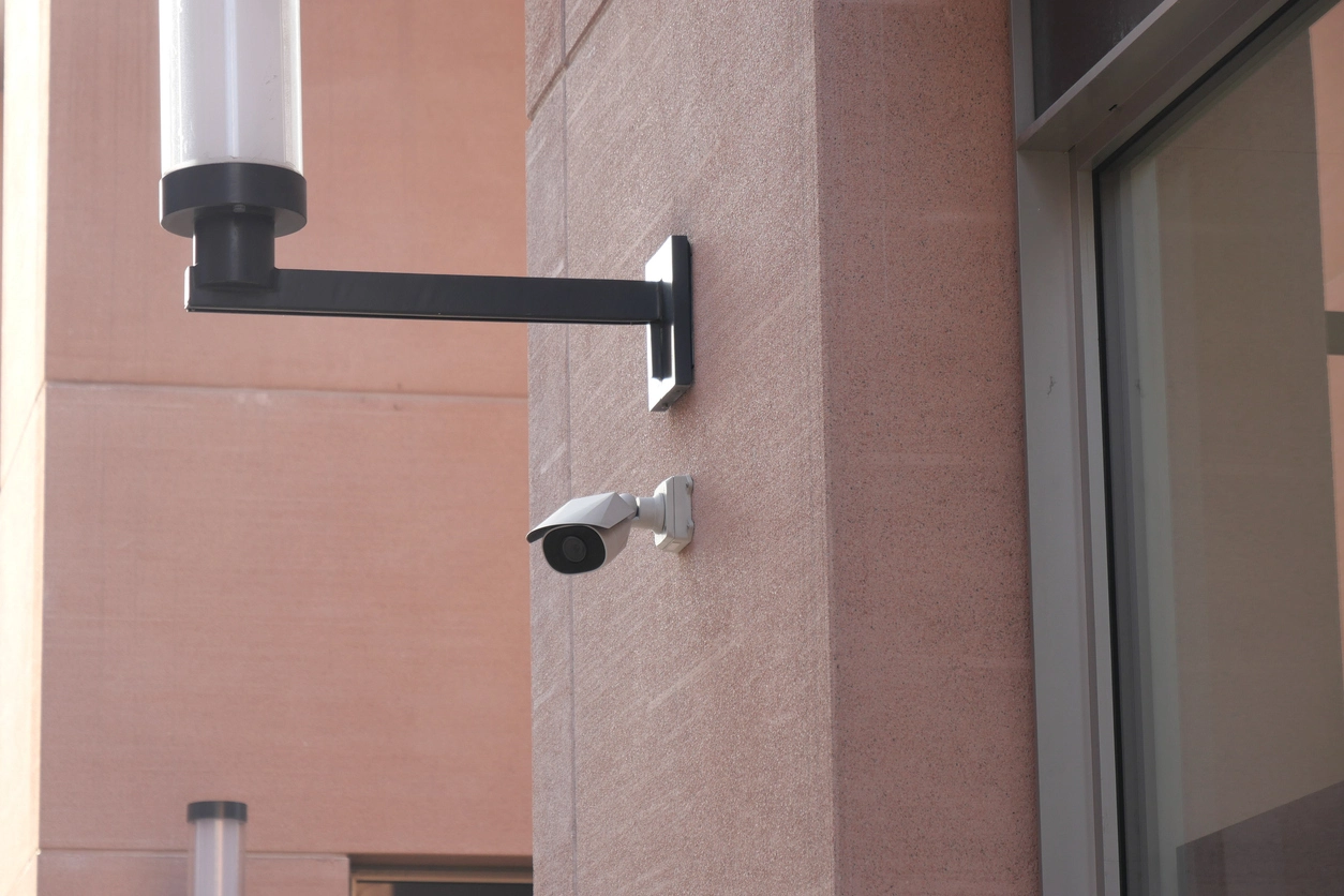 commercial entrance monitored by motion-activated security cameras