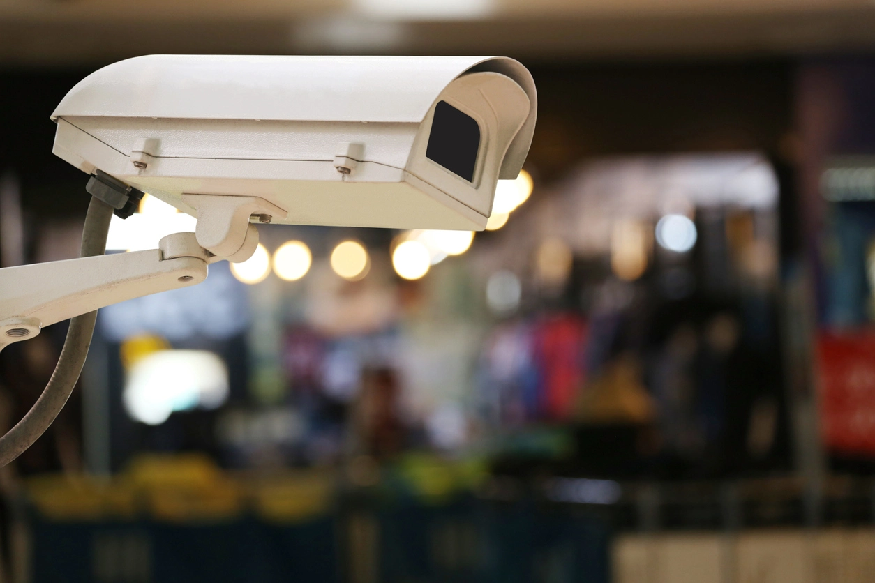 restaurant manager viewing security cameras remotely from mobile app