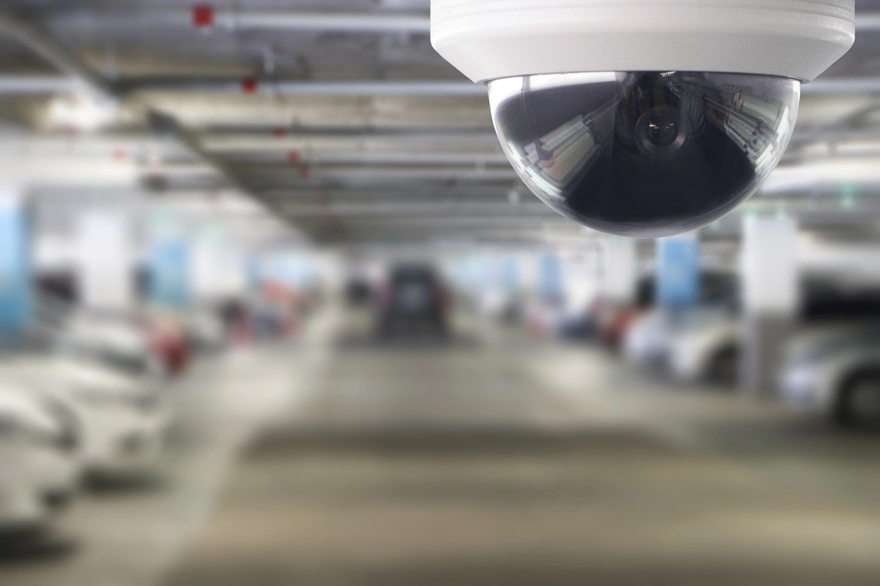 vandal resistant security camera mounted on commercial parking lot exterior