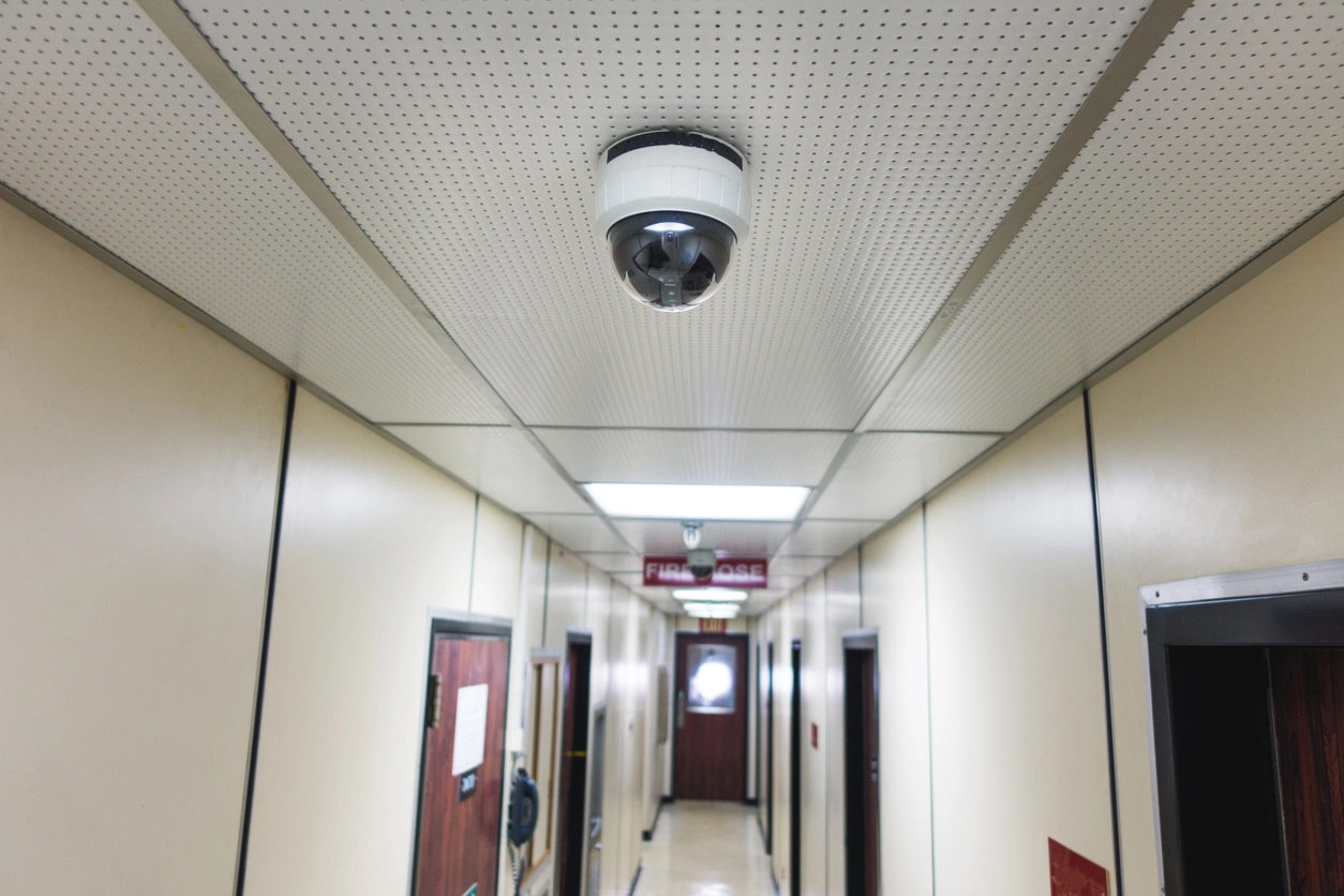 Government facility hallway monitored by security cameras