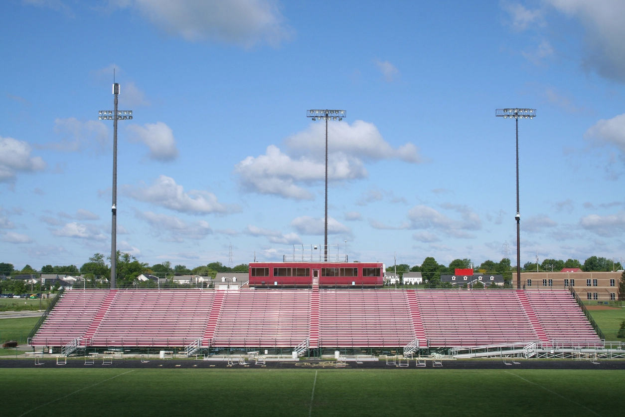 outdoor security camera monitoring parking lot near school athletic field