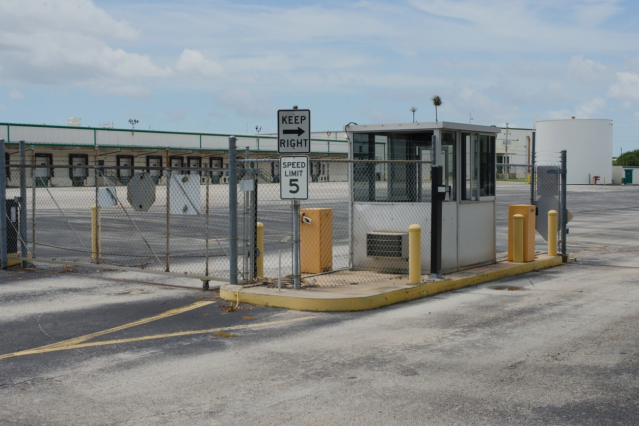 Secured utility gate monitored by commercial security cameras