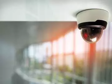 A ceiling mounted camera overlooking the interior of an office building