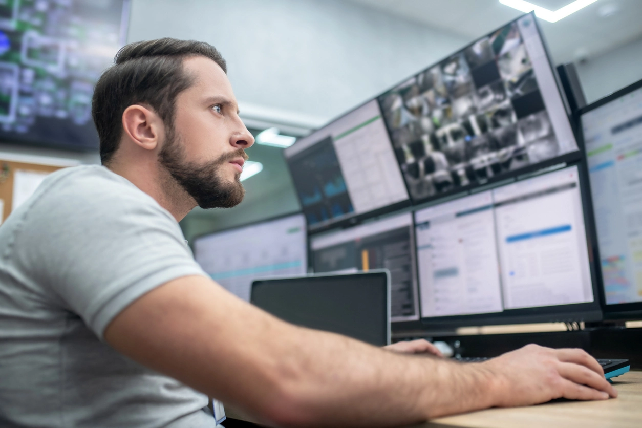 business owner reviewing security cameras remotely from a supported device
